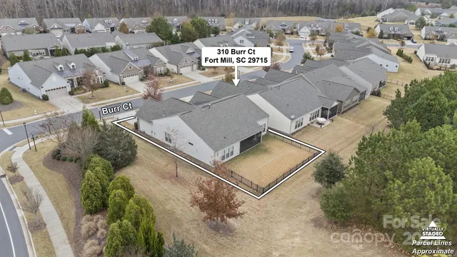 an aerial view of residential house with outdoor space and parking