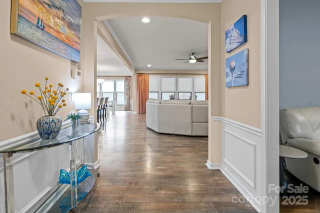 a dining room with furniture and a kitchen view