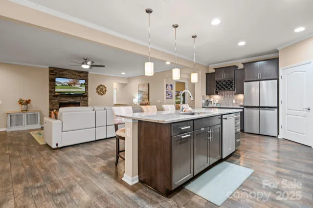 a kitchen with kitchen island cabinets and refrigerator