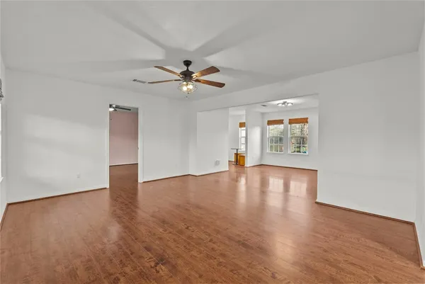 a kitchen with stainless steel appliances granite countertop a refrigerator a stove a sink and a microwave