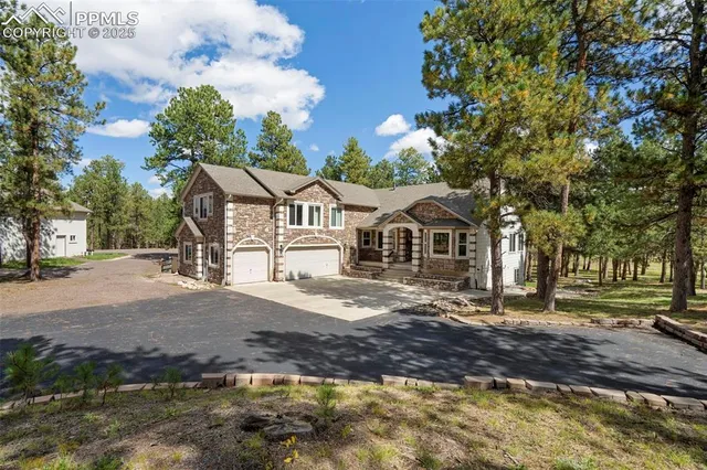 a view of an empty room with a fireplace