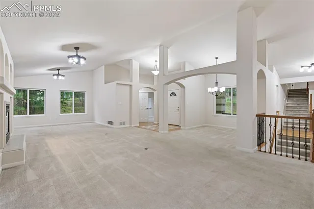 a kitchen with kitchen island a sink counter top space and appliances