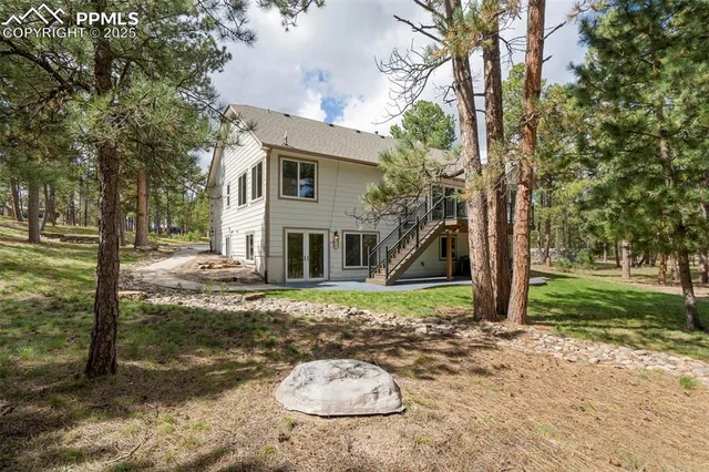 a view of an empty room with a cabinet and a window