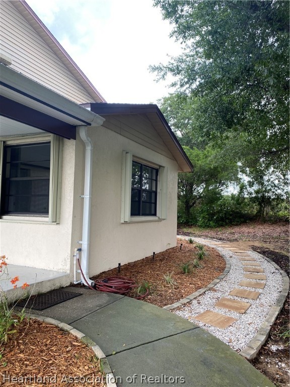 15 Victory Way Lake Placid, FL 33852 - Photo 3 of 36 a view of a house with a yard