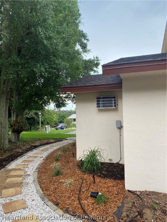 15 Victory Way Lake Placid, FL 33852 - Photo 34 of 36 a front view of a house with garden