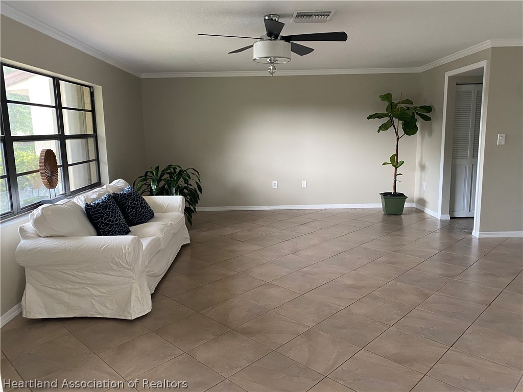 15 Victory Way Lake Placid, FL 33852 - Photo 6 of 36 a living room with furniture and a window
