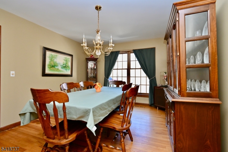 189 School House Road Oak Ridge, NJ 07438 - Photo 11 of 29 a view of a dining room with furniture window and wooden floor