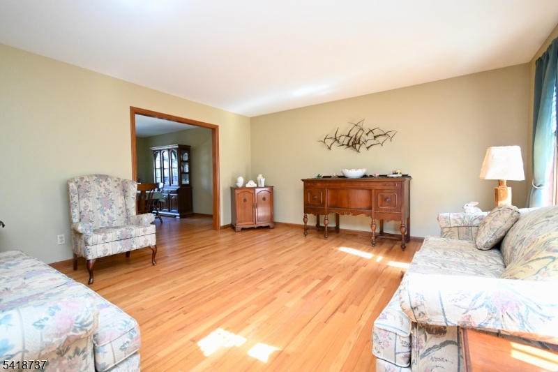 189 School House Road Oak Ridge, NJ 07438 - Photo 14 of 29 a bedroom with a bed and a couch