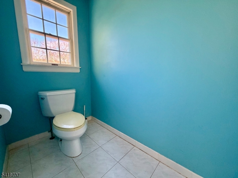189 School House Road Oak Ridge, NJ 07438 - Photo 19 of 29 a white toilet sitting next to a window