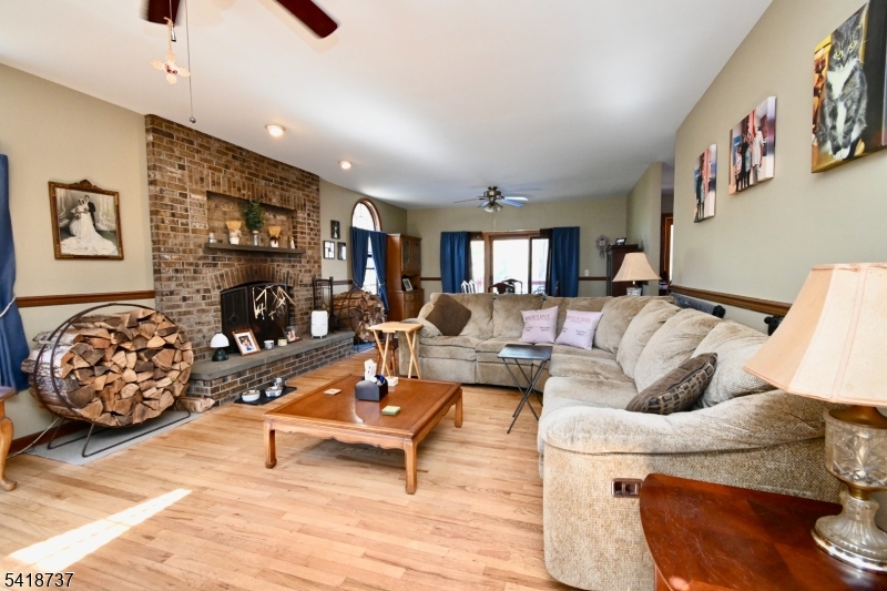 189 School House Road Oak Ridge, NJ 07438 - Photo 2 of 29 a living room with furniture and a flat screen tv