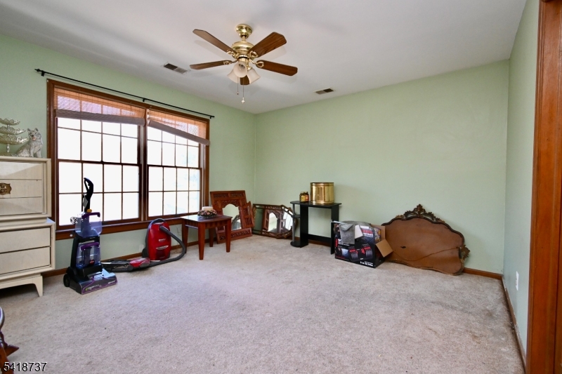 189 School House Road Oak Ridge, NJ 07438 - Photo 21 of 29 a bedroom with furniture and a window