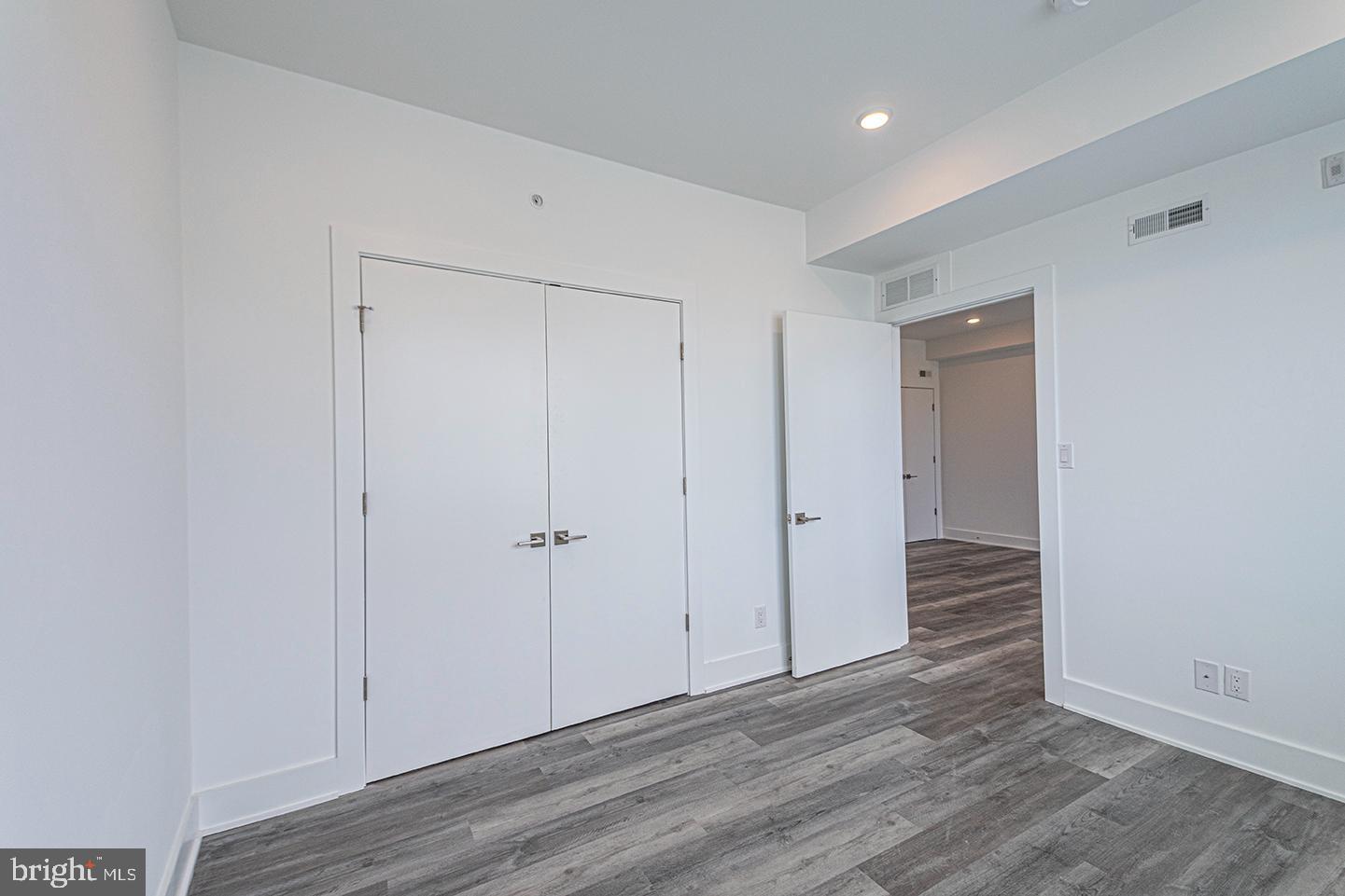 1245 Ridge Avenue, Unit 309 Philadelphia, PA 19123 - Photo 14 of 21 a view of an empty room with wooden floor