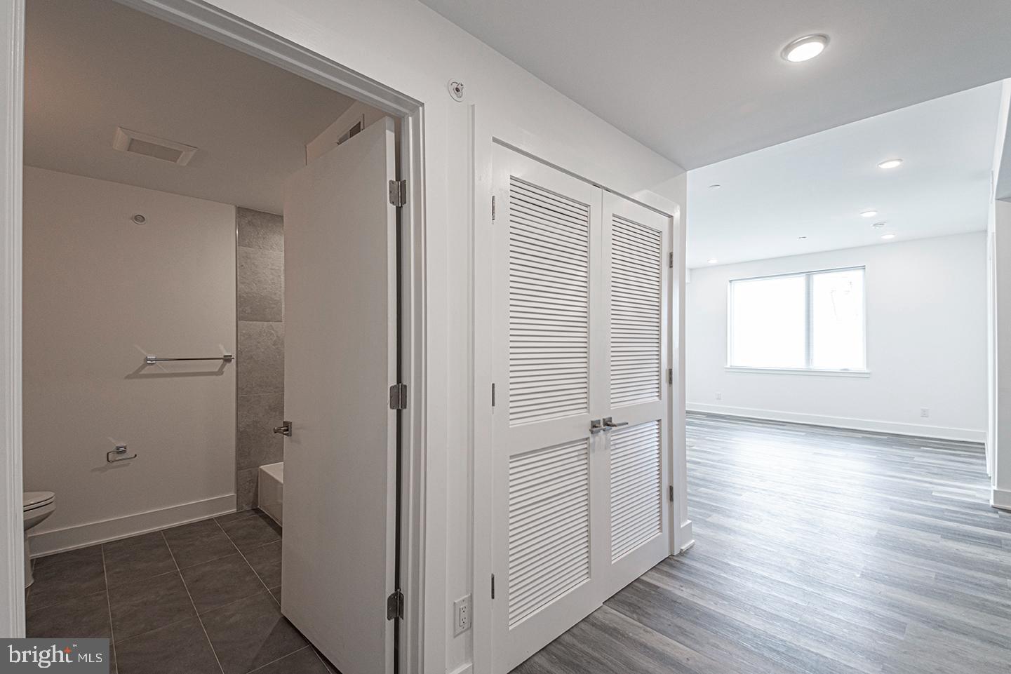 1245 Ridge Avenue, Unit 309 Philadelphia, PA 19123 - Photo 2 of 21 an empty room with wooden floor and a window