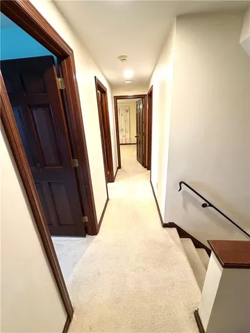 a view of a hallway with a white walls