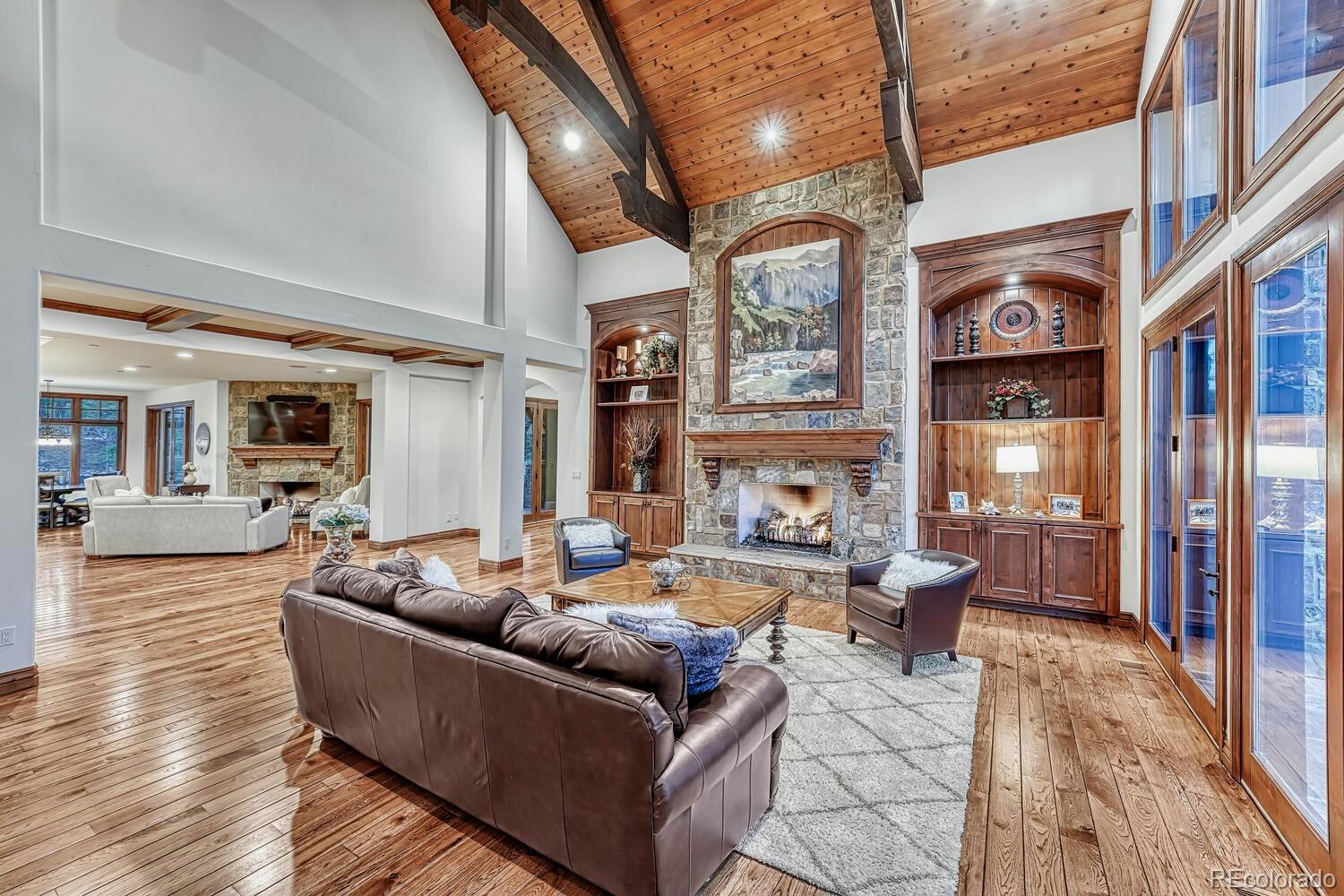 7959 Forest Keep Circle Parker, CO 80134 - Photo 17 of 40 a living room with fireplace furniture and a rug