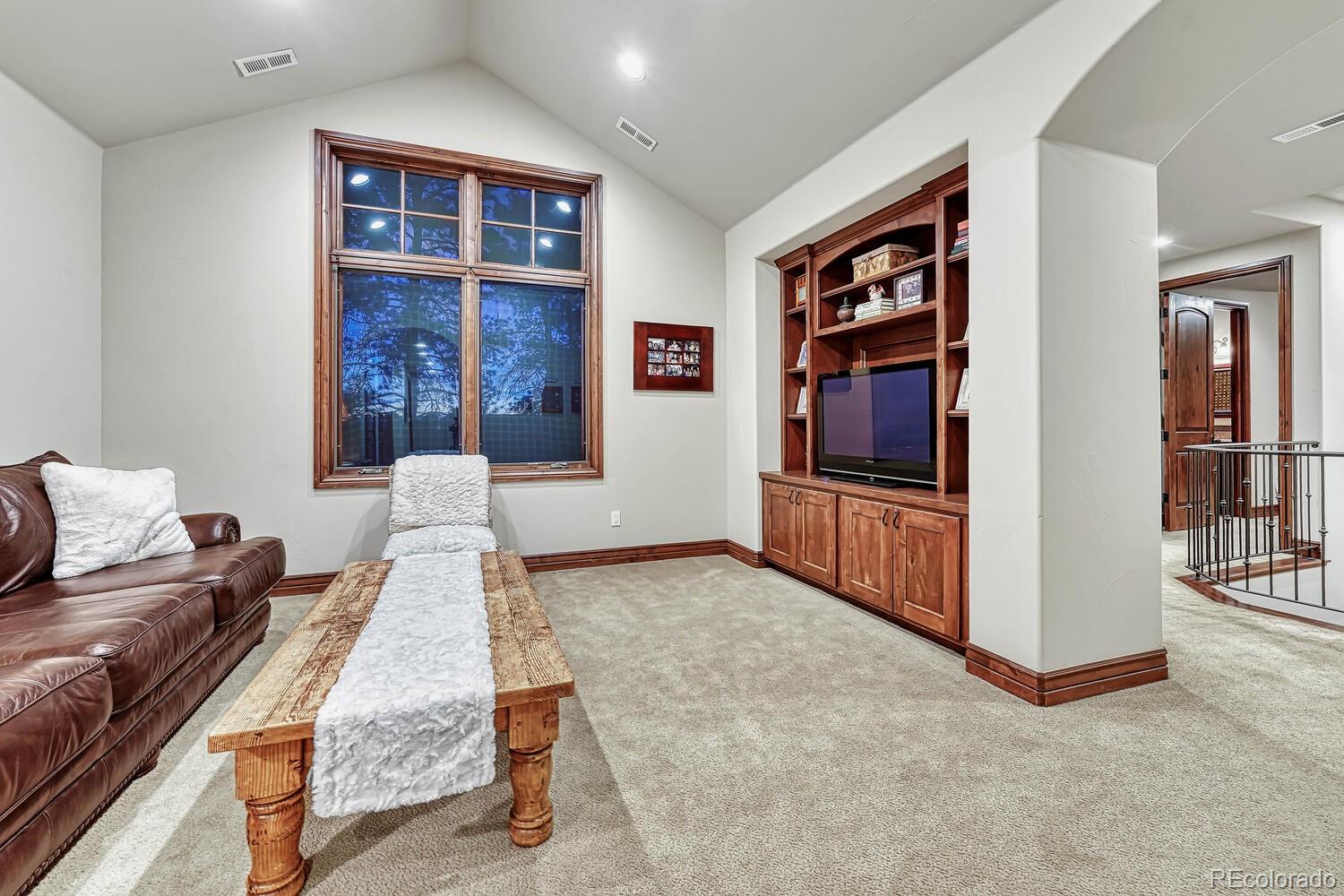 7959 Forest Keep Circle Parker, CO 80134 - Photo 23 of 40 a living room with furniture and large window