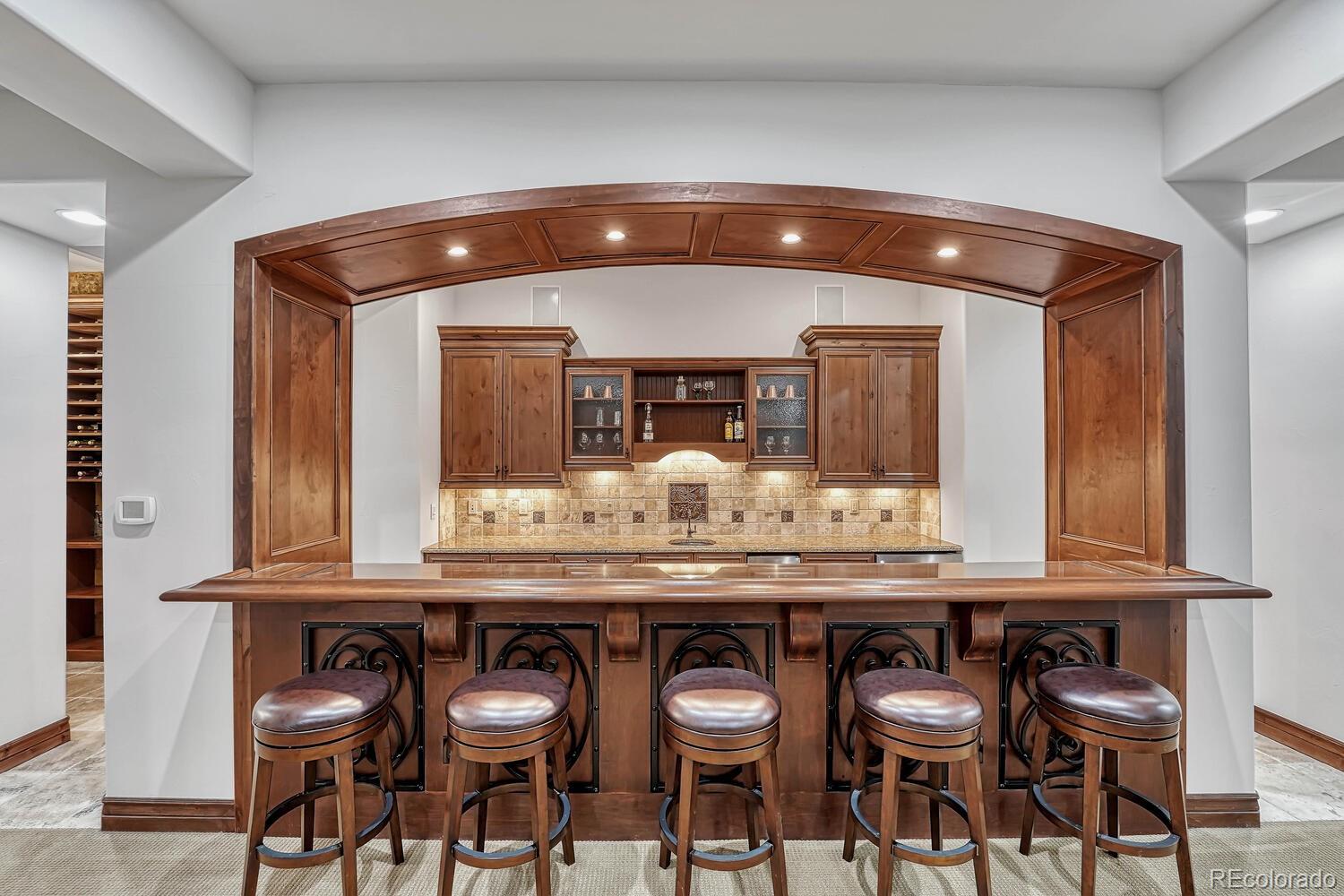 7959 Forest Keep Circle Parker, CO 80134 - Photo 27 of 40 a kitchen with a table and chairs in it