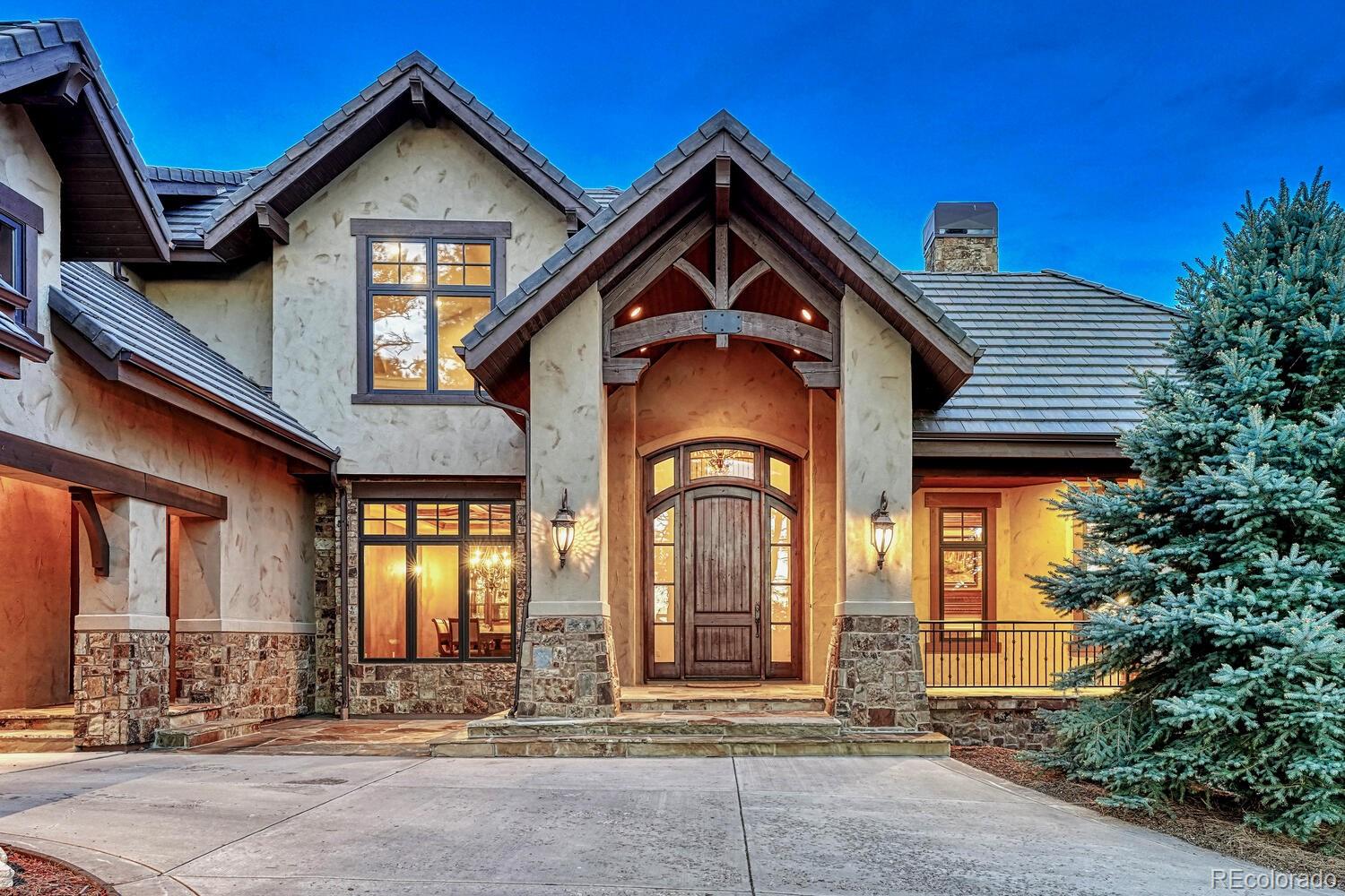 7959 Forest Keep Circle Parker, CO 80134 - Photo 4 of 40 a front view of a house with a yard