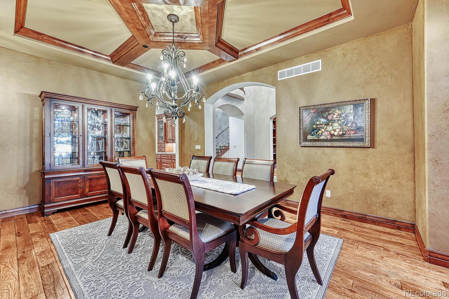 7959 Forest Keep Circle Parker, CO 80134 - Photo 7 of 40 a view of a dining room with furniture and wooden floor