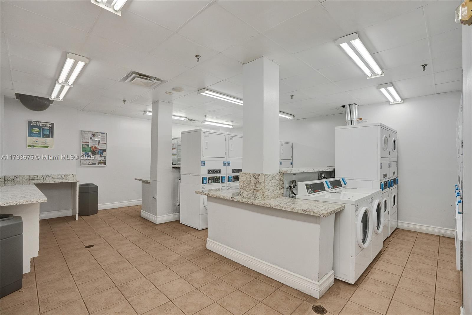850 North Miami Avenue, Unit W1810 Miami, FL 33136 - Photo 21 of 31 a kitchen with a sink and chairs