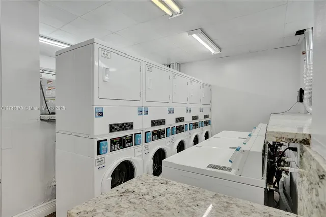 a view of living room with furniture and white walls