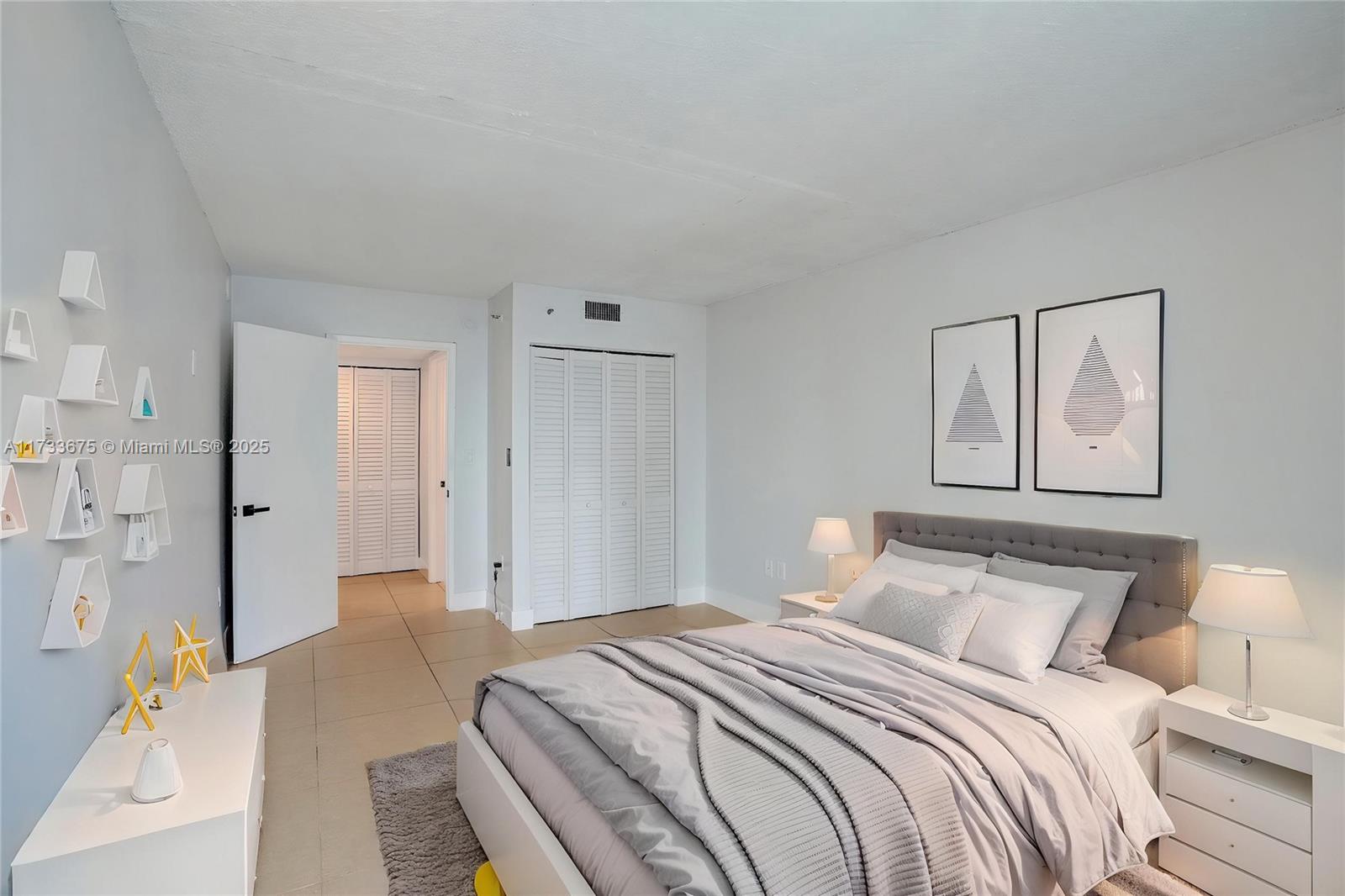 850 North Miami Avenue, Unit W1810 Miami, FL 33136 - Photo 7 of 31 a bedroom with a bed and a painting on the wall