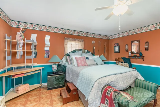 a bedroom with a bed and window