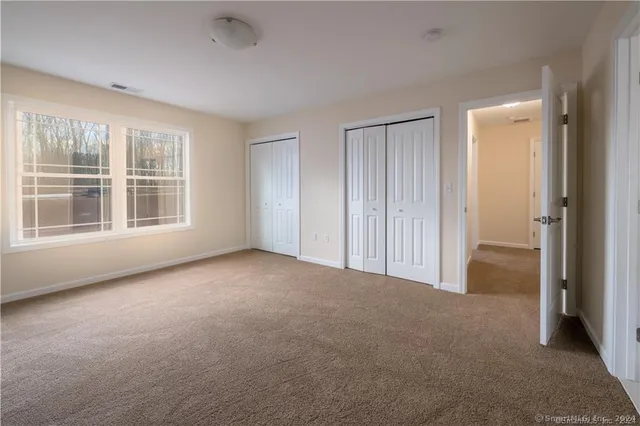 a view of empty room with windows