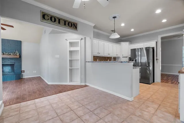 a large kitchen with cabinets and stainless steel appliances