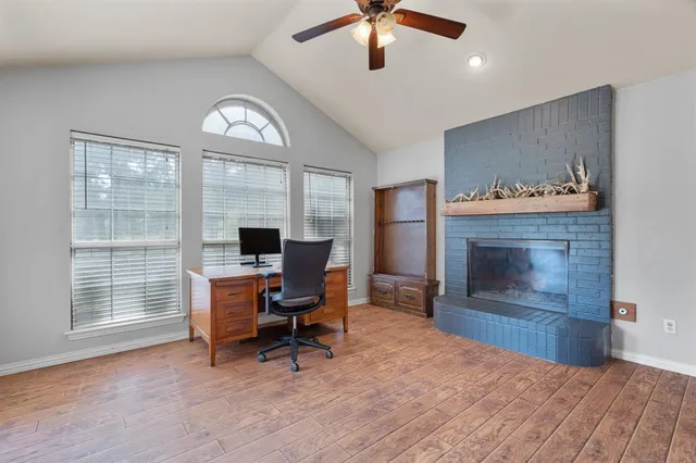 a view of a livingroom with furniture and a fireplace