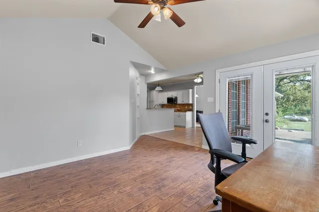 a view of a livingroom with furniture and a window
