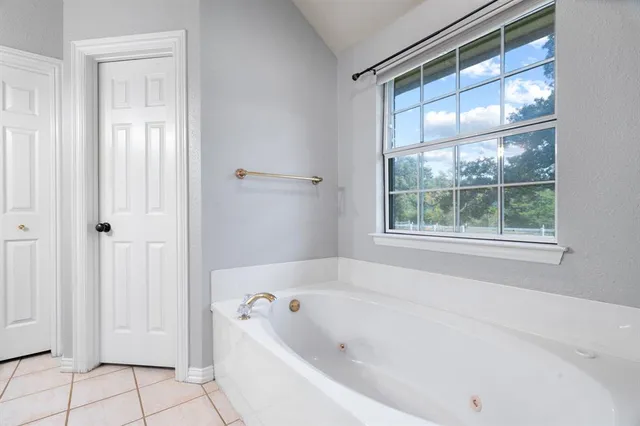 a bathroom with a bathtub and shower