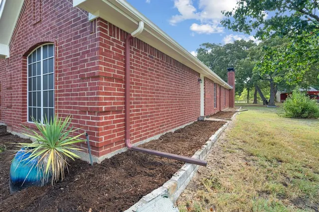 a backyard of a house with palm trees
