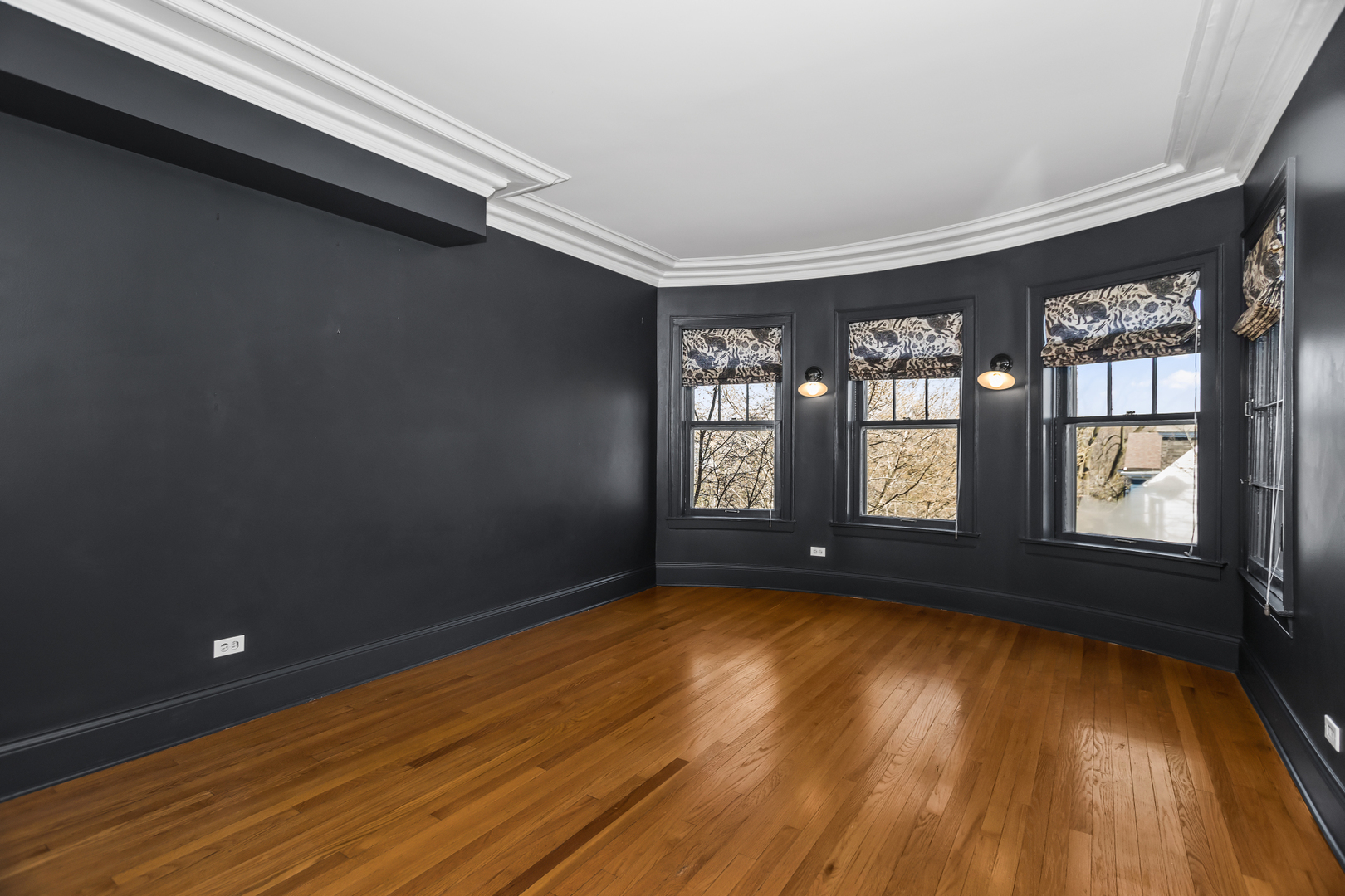 240 Lee Street, Unit 3 Evanston, IL 60202 - Photo 12 of 23 a view of an empty room with wooden floor and a window