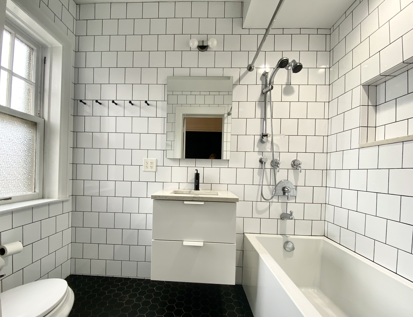 240 Lee Street, Unit 3 Evanston, IL 60202 - Photo 13 of 23 a bathroom with a sink toilet and shower