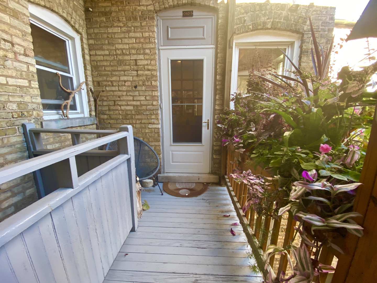240 Lee Street, Unit 3 Evanston, IL 60202 - Photo 19 of 23 a view of a porch with wooden stairs