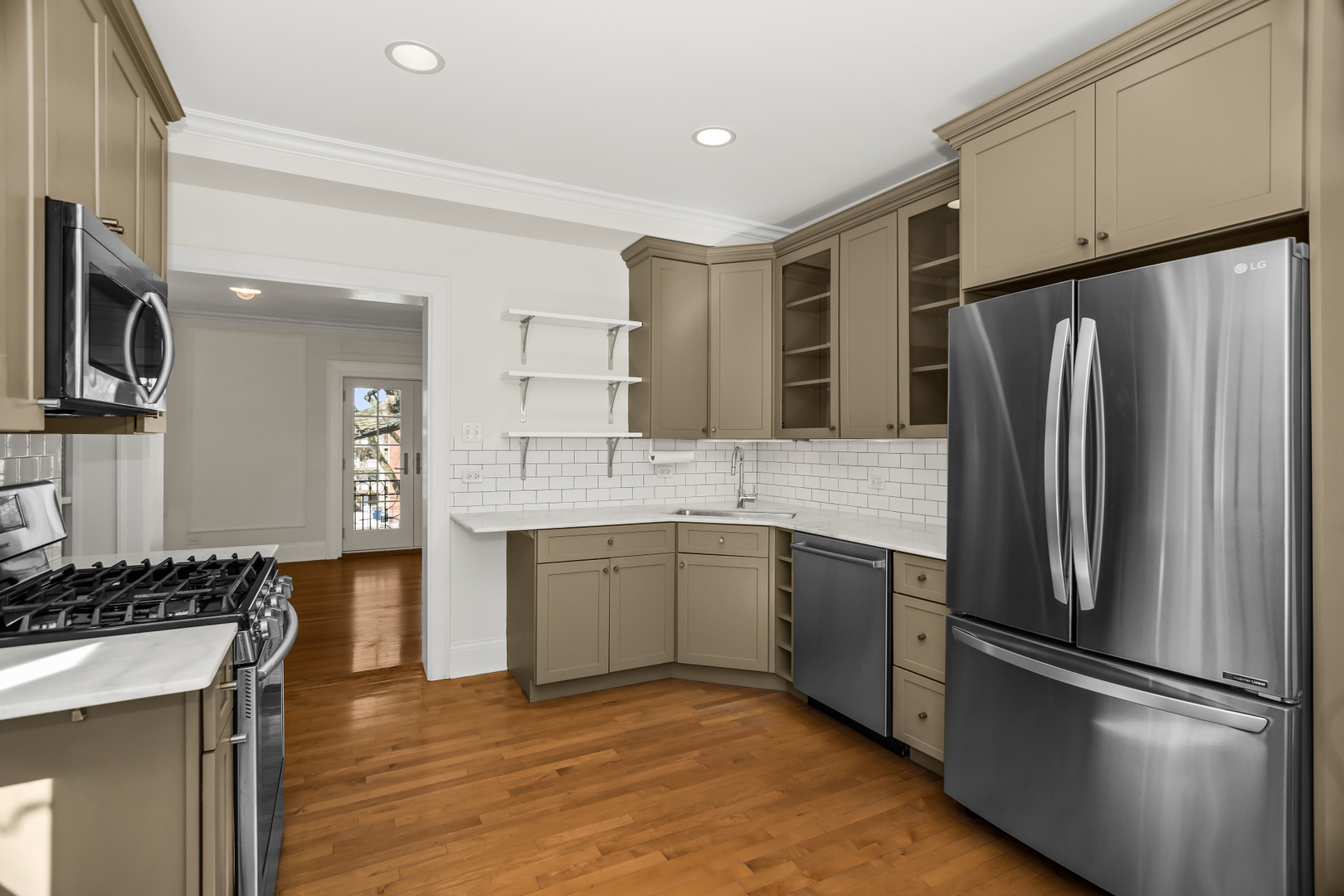 240 Lee Street, Unit 3 Evanston, IL 60202 - Photo 10 of 23 a kitchen with a refrigerator sink and microwave
