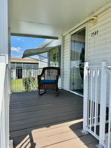 a view of front door and deck of the house