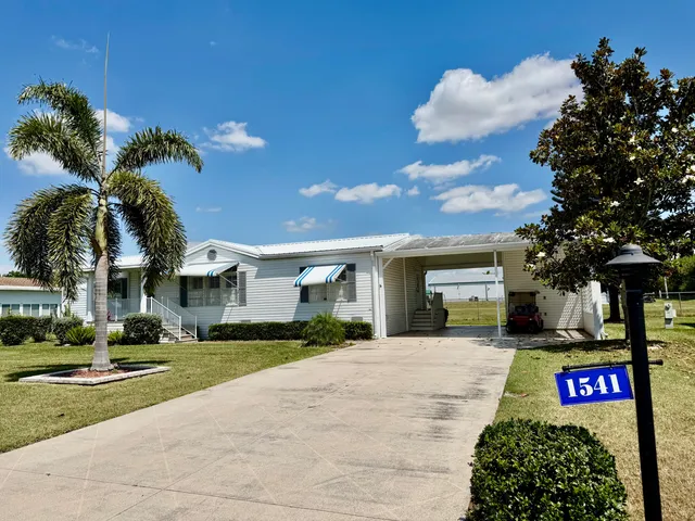 a sign board on the side of the road