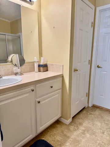 a bathroom with a sink and a mirror