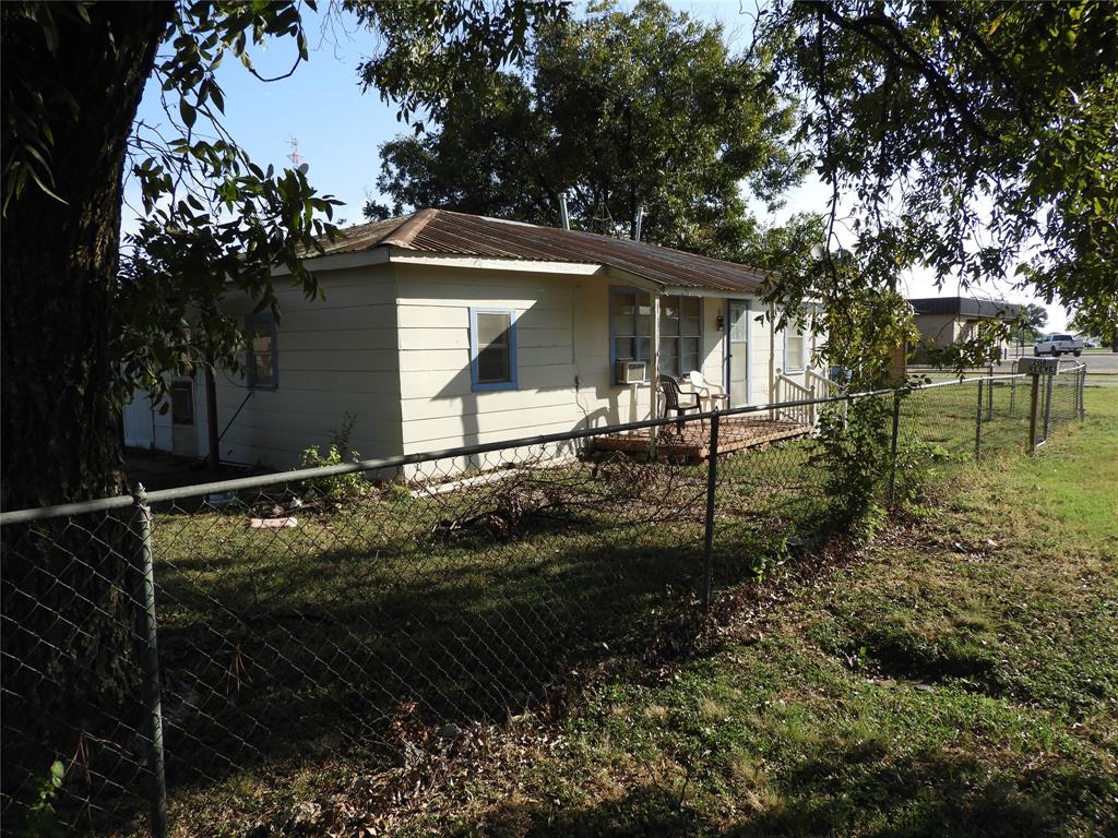 208 Reeves Street Winters, TX 79567 - Photo 2 of 14 a backyard of a house with lots of green space