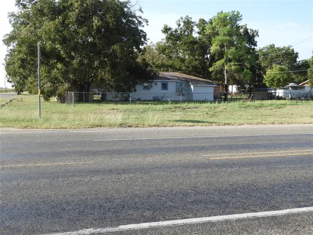 a view of outdoor space with deck and yard