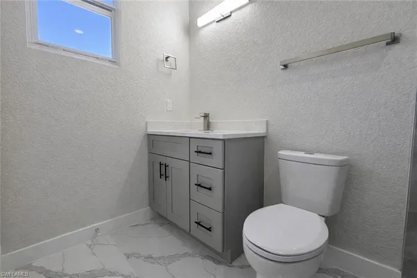 a bathroom with a shower and toilet