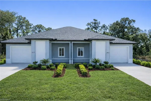 a front view of a house with garden