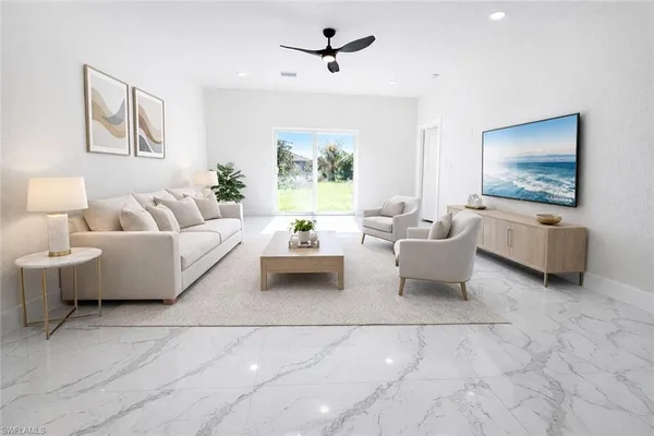 a living room with furniture and a flat screen tv