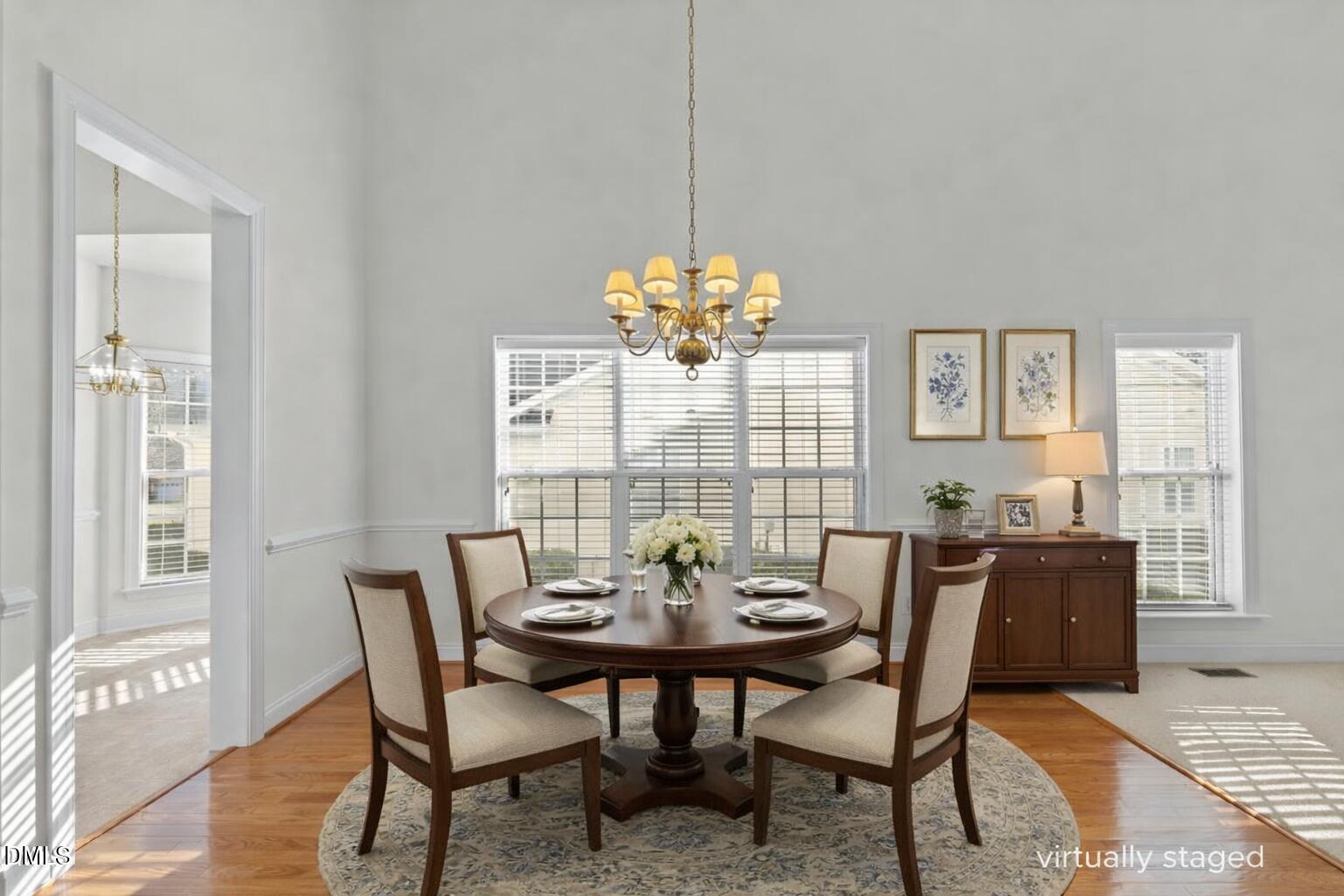 105 Rockport Ridge Way Cary, NC 27519 - Photo 11 of 43 a view of a dining room with furniture and window