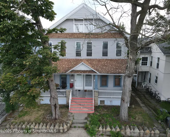 a front view of a house with a porch