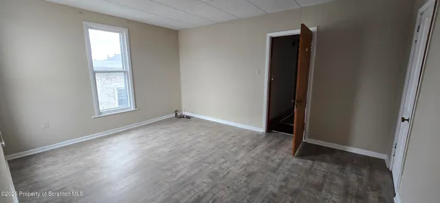 a view of a livingroom from a hallway