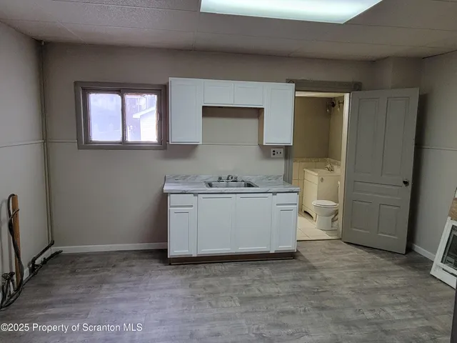 a bathroom with a sink and toilet