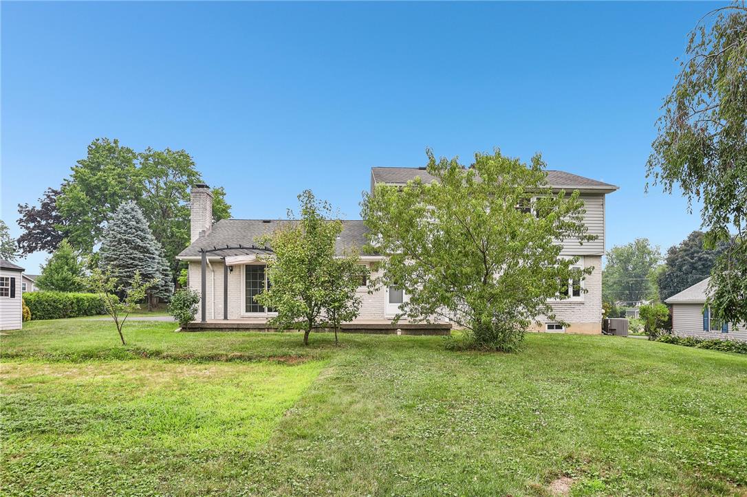 3659 Ironstone Road Bethlehem, PA 18020 - Photo 12 of 52 A verdant lawn surrounds this home, featuring a back deck perfect for outdoor enjoyment.